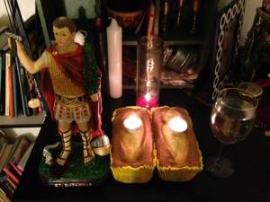 Offerings given to St. Expedite in thanks for his aiding a client.